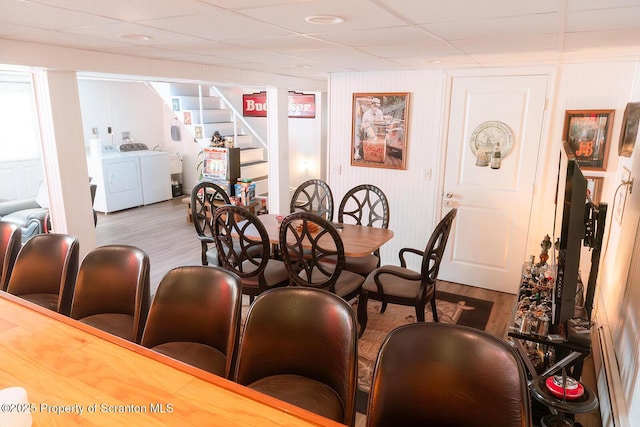 118 Howard St, Old Forge, PA 18518 - dining room featuring wood finished floors, washing machine and dryer, and stairs