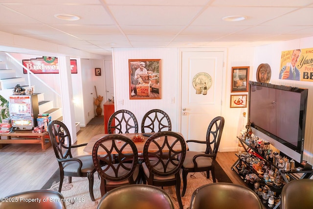 118 Howard St, Old Forge, PA 18518 - dining room with light wood finished floors, a drop ceiling, and stairs