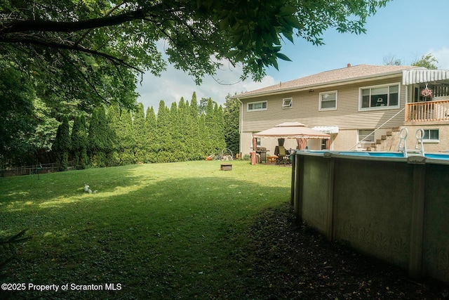 118 Howard St, Old Forge, PA 18518 - view of green lawn featuring a gazebo, an outdoor pool, and stairs