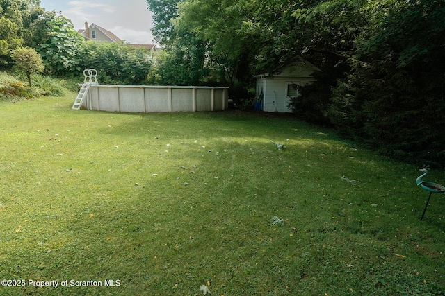 118 Howard St, Old Forge, PA 18518 - view of green lawn featuring an outdoor pool