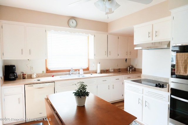 118 Howard St, Old Forge, PA 18518 - kitchen featuring dishwasher, oven, under cabinet range hood, and black electric cooktop
