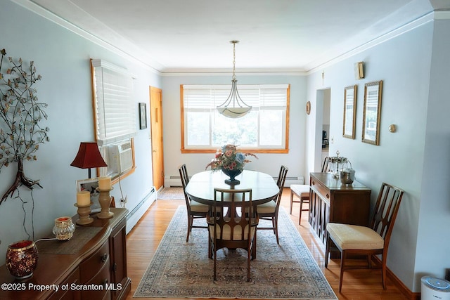 118 Howard St, Old Forge, PA 18518 - dining room featuring baseboard heating, wood finished floors, a baseboard radiator, and ornamental molding