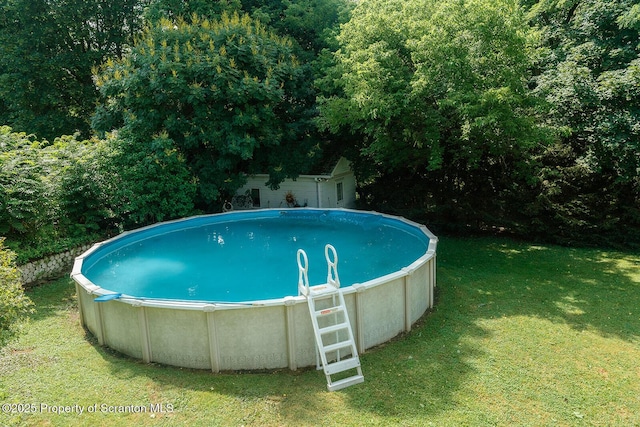 118 Howard St, Old Forge, PA 18518 - outdoor pool featuring a lawn