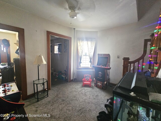 game room with radiator and carpet floors