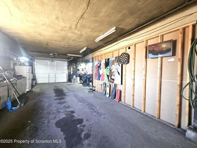 garage featuring freestanding refrigerator