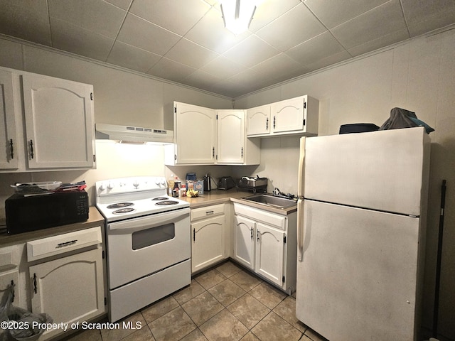 kitchen with tile patterned flooring, under cabinet range hood, white appliances, white cabinetry, and a sink