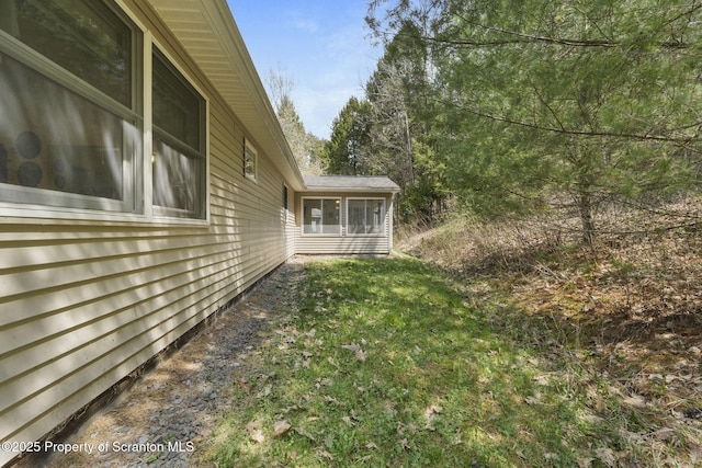 view of yard with a sunroom