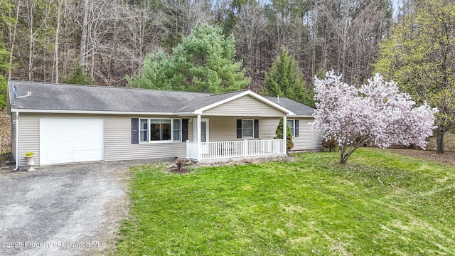 single story home with a shingled roof, a garage, dirt driveway, a front yard, and covered porch