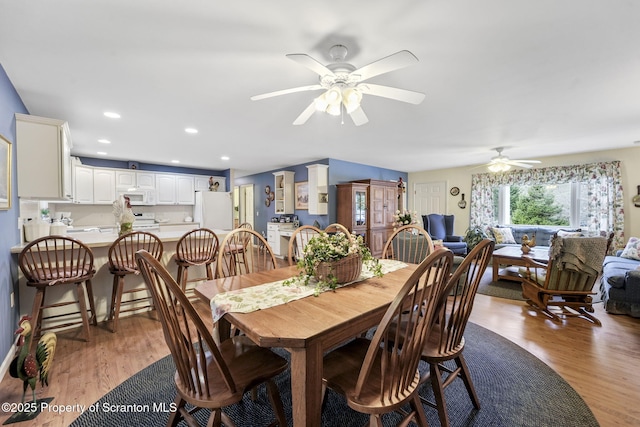 dining area with ceiling fan, recessed lighting, and wood finished floors
