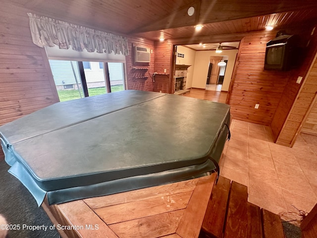 290 Holly Ln, Sturges, PA 18447 - rec room with wooden walls, an AC wall unit, wooden ceiling, ceiling fan, and light tile patterned flooring