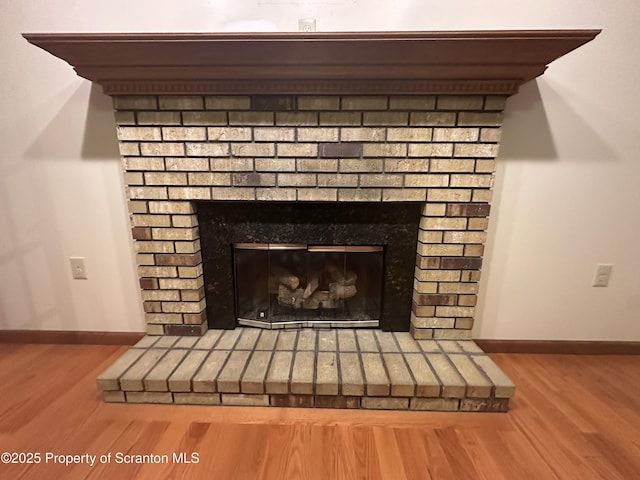 290 Holly Ln, Sturges, PA 18447 - detailed view of a brick fireplace and wood finished floors