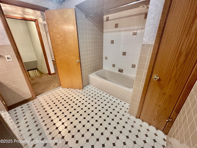 290 Holly Ln, Sturges, PA 18447 - full bathroom with shower / bath combination, tile walls, and tile patterned flooring