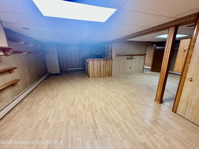 290 Holly Ln, Sturges, PA 18447 - indoor bar with a paneled ceiling, wood finished floors, a baseboard heating unit, and wooden walls