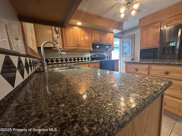 290 Holly Ln, Sturges, PA 18447 - kitchen featuring electric range oven, tasteful backsplash, dark stone counters, under cabinet range hood, and black microwave