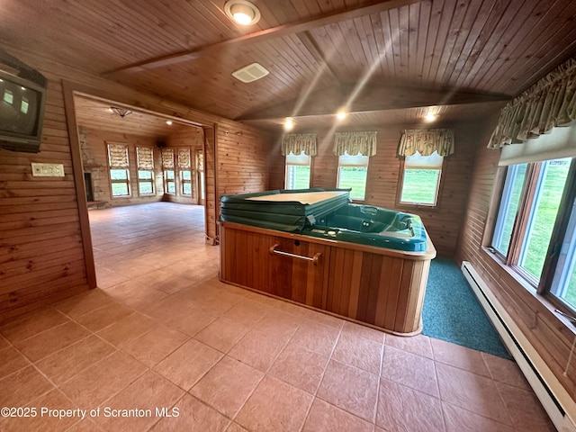 290 Holly Ln, Sturges, PA 18447 - kitchen featuring baseboard heating, wood walls, wood ceiling, open floor plan, and plenty of natural light