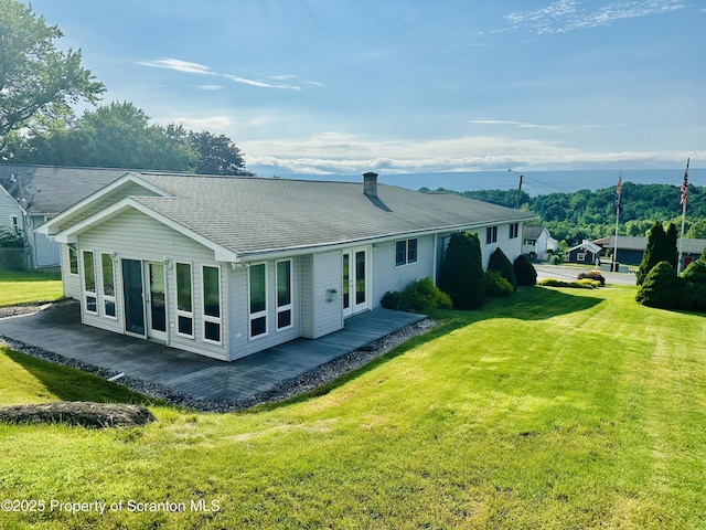 290 Holly Ln, Sturges, PA 18447 - back of property featuring a yard, roof with shingles, and a chimney