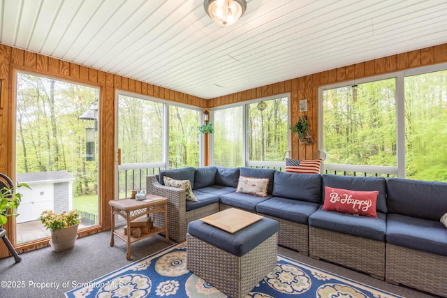210 Willow Dr, Jefferson Twp, PA 18436 - sunroom / solarium featuring outdoor lounge area, plenty of natural light, wood walls, and carpet