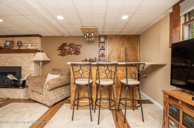 210 Willow Dr, Jefferson Twp, PA 18436 - indoor dry bar featuring recessed lighting, wood finished floors, baseboards, and a fireplace