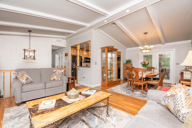 210 Willow Dr, Jefferson Twp, PA 18436 - living area featuring a chandelier, wood finished floors, and baseboards