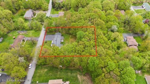 210 Willow Dr, Jefferson Twp, PA 18436 - aerial overview of property's location with property parcel outlined and a forest