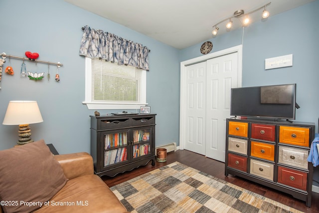 210 Willow Dr, Jefferson Twp, PA 18436 - living area featuring dark wood-style floors and a baseboard radiator