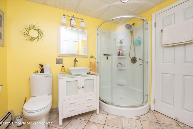 210 Willow Dr, Jefferson Twp, PA 18436 - full bath featuring a baseboard radiator, a stall shower, toilet, vanity, and tile patterned flooring