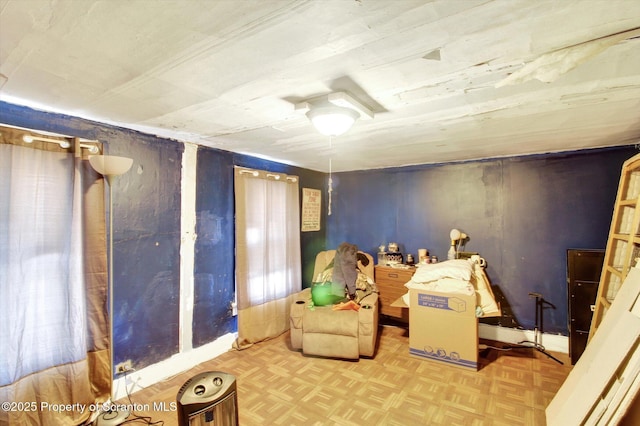 living area featuring parquet flooring