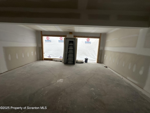 empty room with concrete flooring