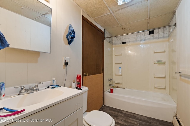 full bath featuring shower / bathing tub combination, wood finished floors, toilet, and vanity