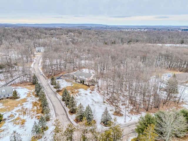 drone / aerial view with a view of trees