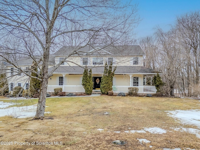 view of front of home with a front lawn and a porch