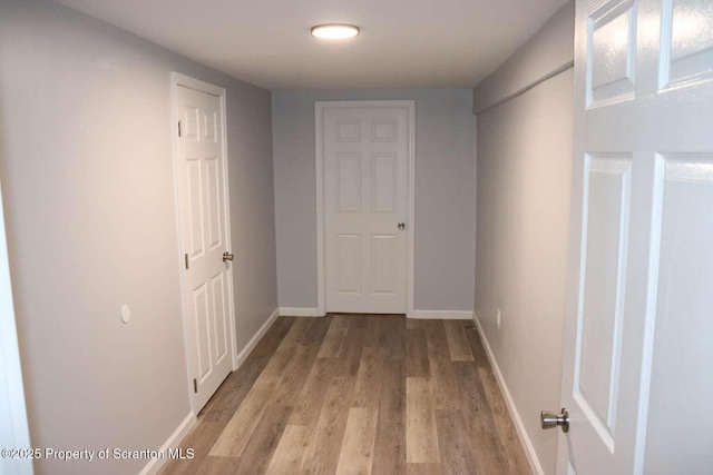 corridor featuring light hardwood / wood-style floors