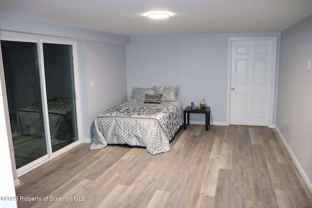 bedroom with light hardwood / wood-style floors