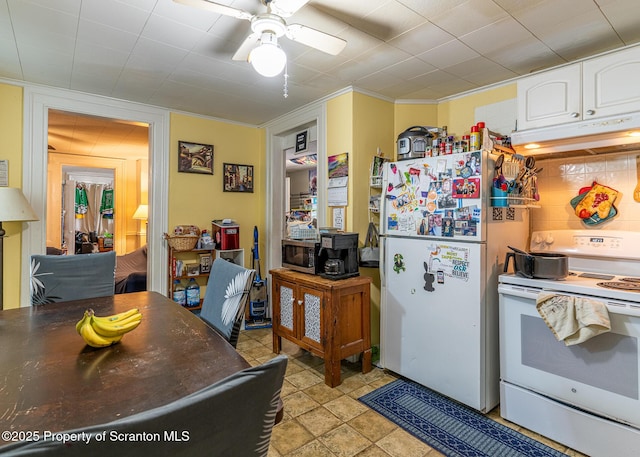 989 Main St, New Milford, PA 18834 - kitchen featuring white appliances, under cabinet range hood, white cabinets, a ceiling fan, and crown molding