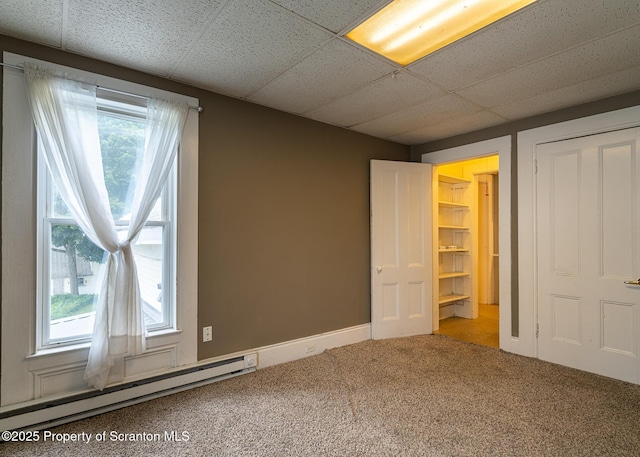 989 Main St, New Milford, PA 18834 - unfurnished bedroom featuring baseboard heating, carpet floors, and a drop ceiling