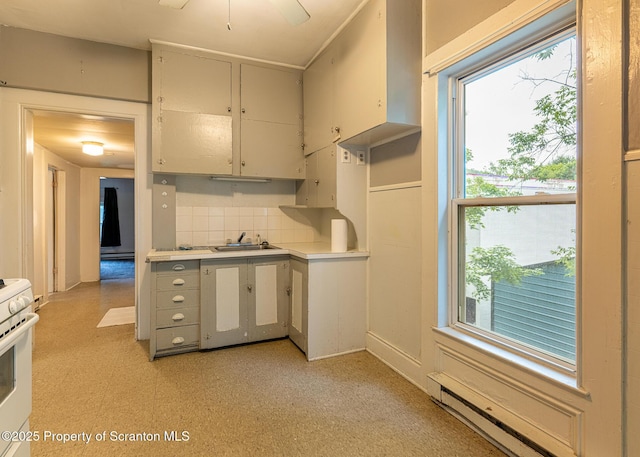 989 Main St, New Milford, PA 18834 - kitchen featuring white range, light flooring, light countertops, and healthy amount of natural light