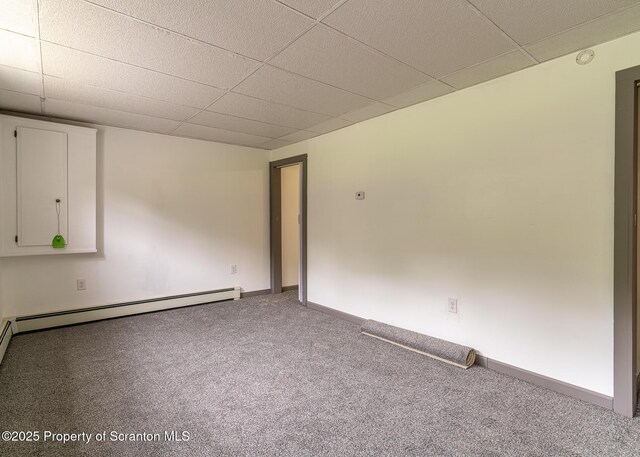 989 Main St, New Milford, PA 18834 - carpeted spare room featuring a drop ceiling, a baseboard radiator, and a smoke detector