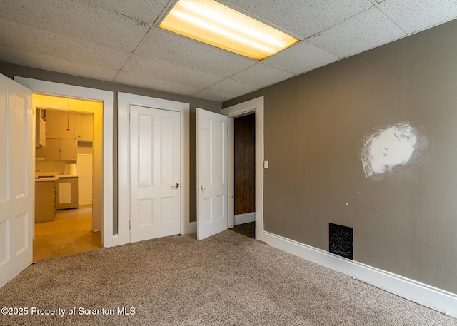 989 Main St, New Milford, PA 18834 - unfurnished bedroom featuring carpet, a paneled ceiling, and a closet