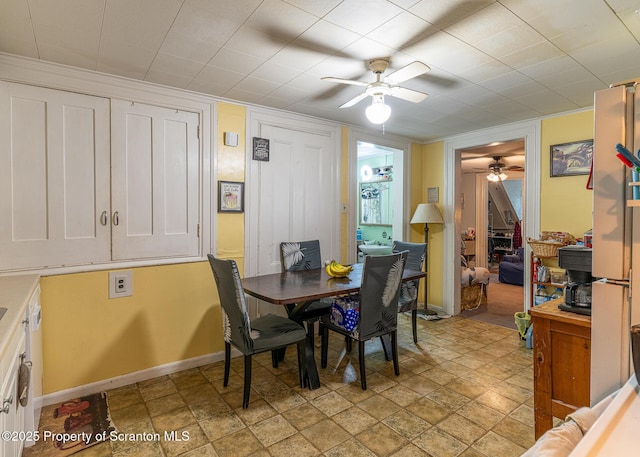 989 Main St, New Milford, PA 18834 - dining space featuring a ceiling fan and light stone finish floors