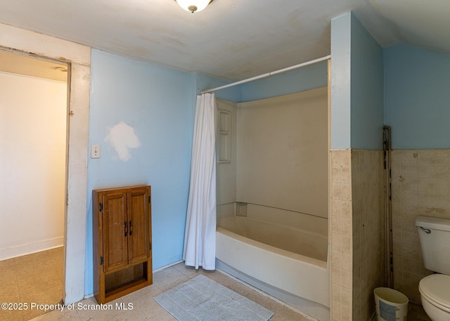 989 Main St, New Milford, PA 18834 - bathroom with shower / tub combo and tile walls