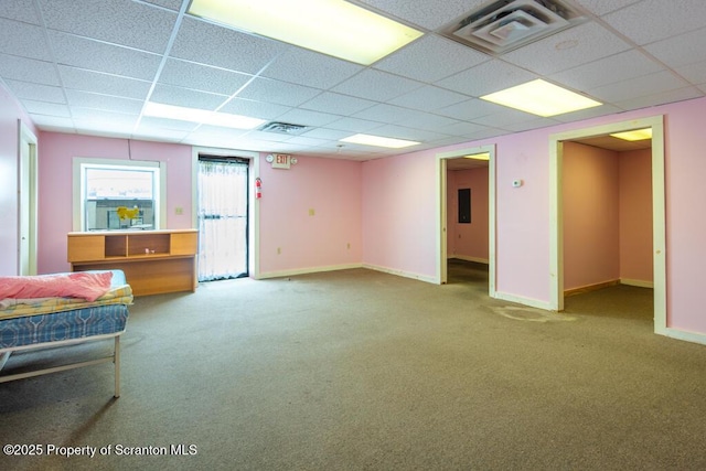 interior space featuring baseboards, visible vents, and carpet floors