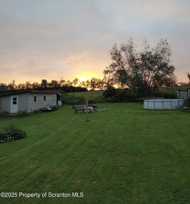 view of yard with an outdoor pool