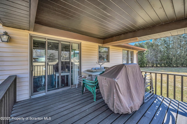 deck with a lawn and a grill