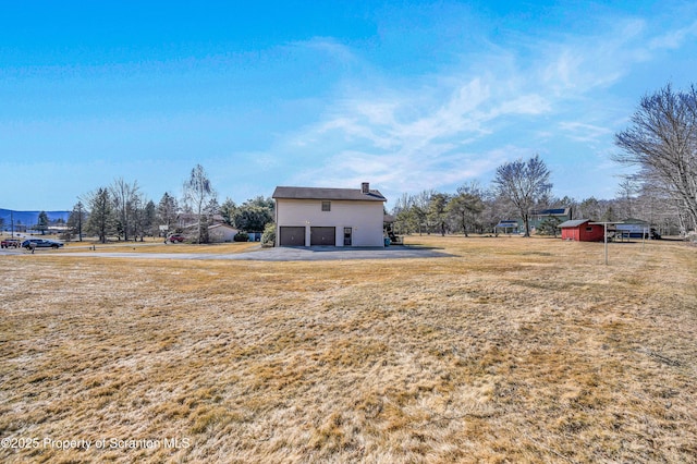 view of yard with a garage