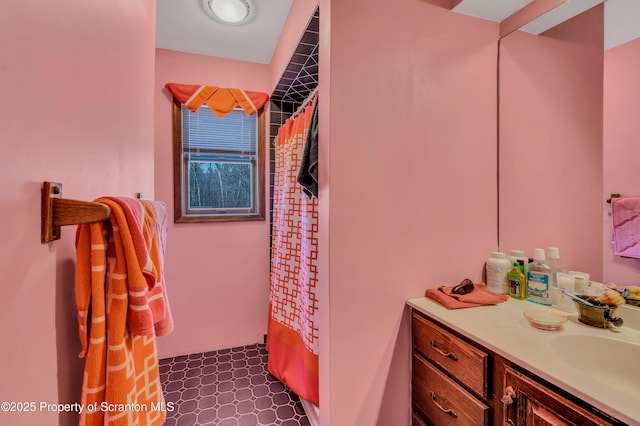 full bathroom with a shower with shower curtain and vanity