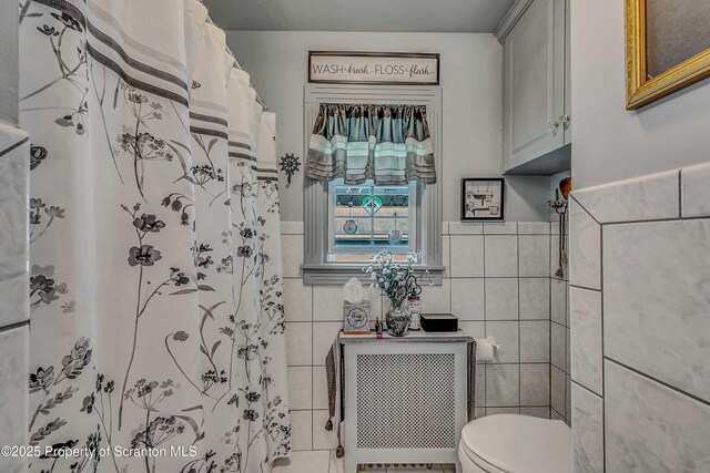 2230 Birney Ave, Scranton, PA 18505 - full bath with tile walls, toilet, a wainscoted wall, radiator heating unit, and a shower with curtain