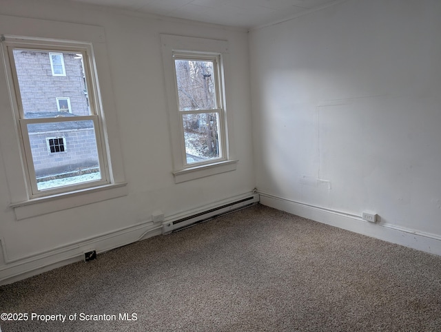 unfurnished room with baseboard heating and carpet