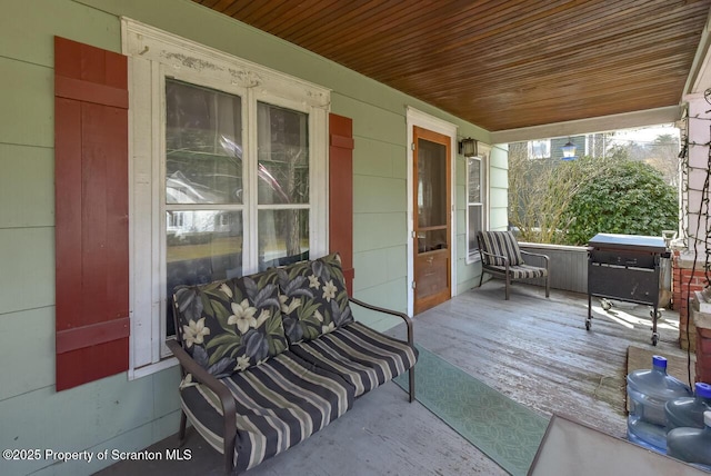 exterior space with wood ceiling