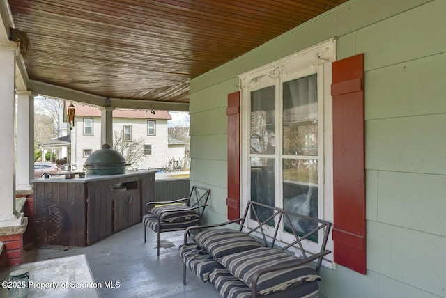 view of patio with a porch and area for grilling