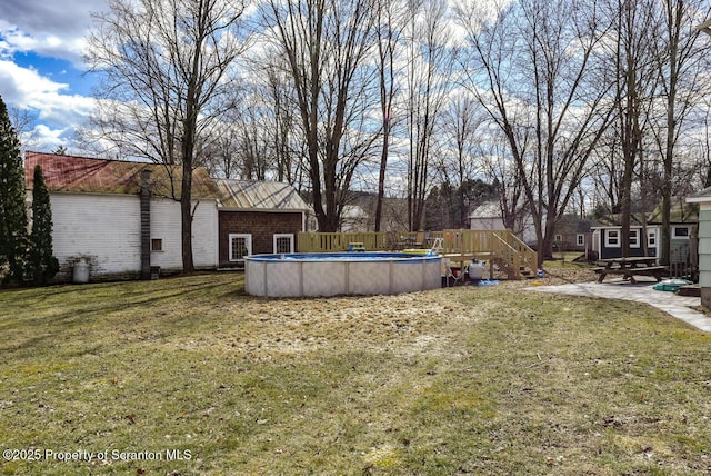 view of yard featuring an outdoor pool